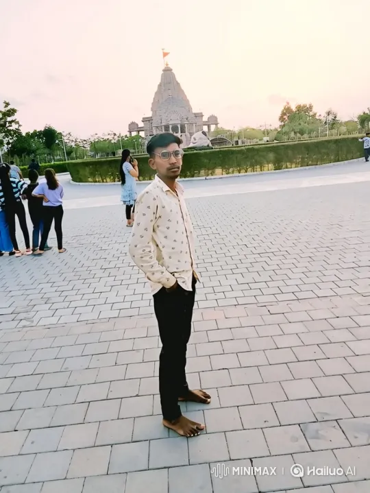 Young Man Contemplates in Front of Stone Temple – AI Generated Video | Hailuo AI