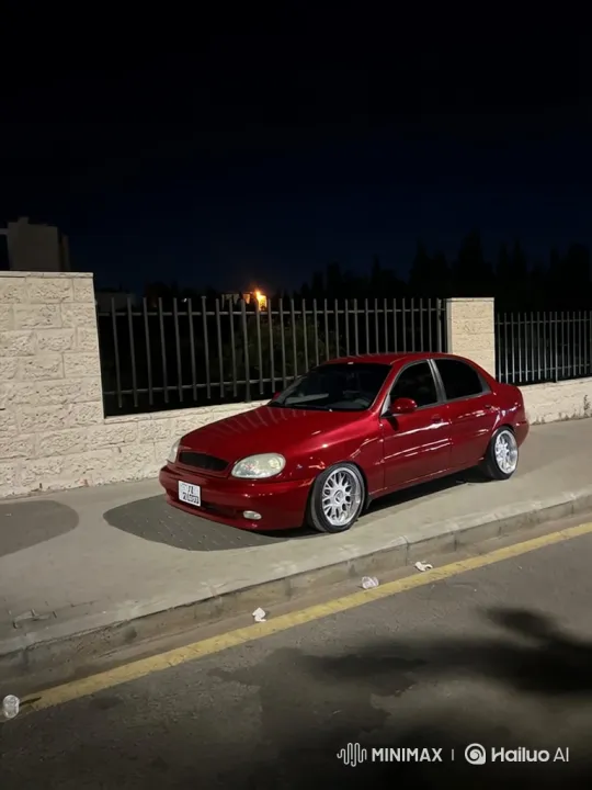 Red Sedan Lowering Simulation at Night – AI Generated Video | Hailuo AI