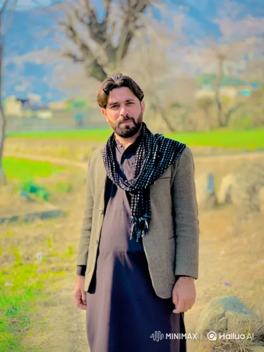 Man in Field: Contemplative Pose Amidst Nature – AI Generated Video | Hailuo AI