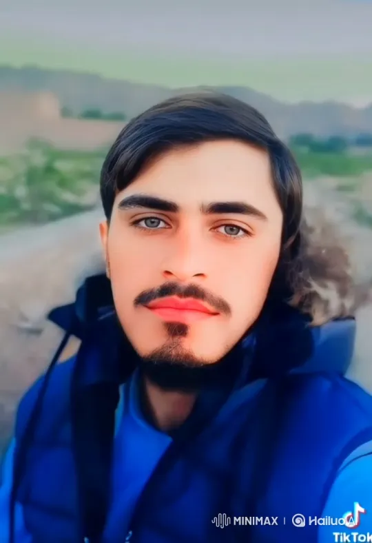 Young Man with Striking Eyes Maintains Gentle Gaze – AI Generated Video | Hailuo AI