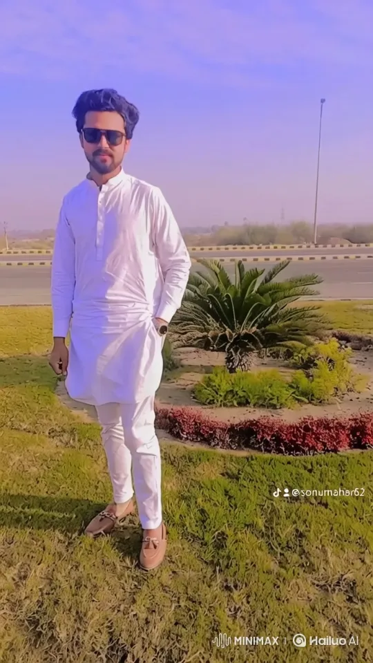 Young Man in White Stands Confidently in Shifting Background – AI Generated Video | Hailuo AI