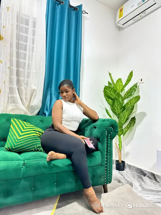 Young Woman Relaxing on Sofa with Smartphone – AI Generated Video | Hailuo AI
