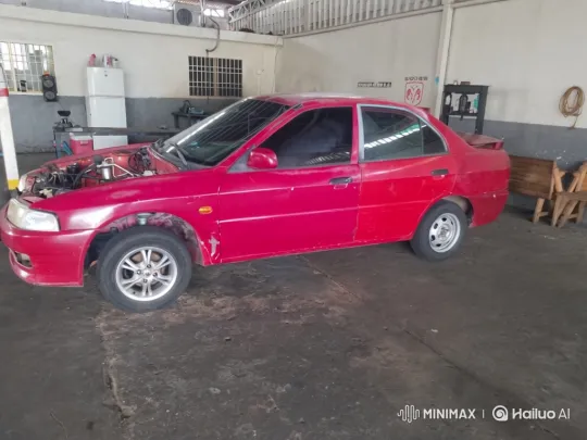 Red Sedan Lowered in Garage During Maintenance – AI Generated Video | Hailuo AI