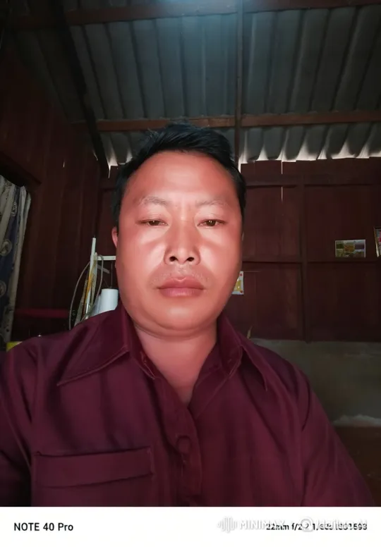 East Asian Man in Contemplative Stare – AI Generated Video | Hailuo AI