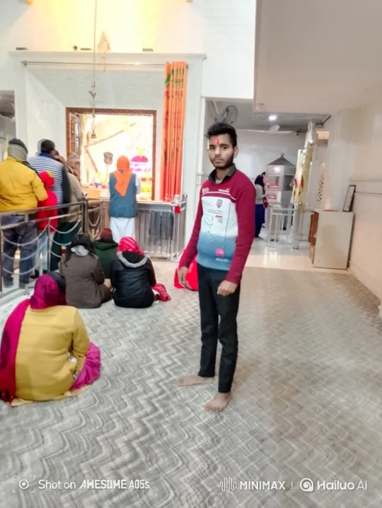 Young Man in Prayerful Hall with Contemplative Gaze – AI Generated Video | Hailuo AI