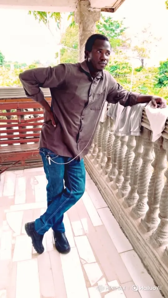 Man on Balcony Reflects with Gentle Smile – AI Generated Video | Hailuo AI