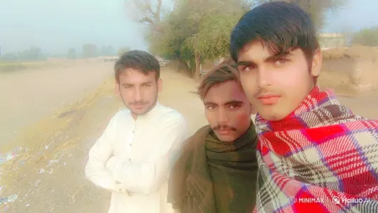 Three Men Pose for Selfie in Hazy Rural Landscape – AI Generated Video | Hailuo AI