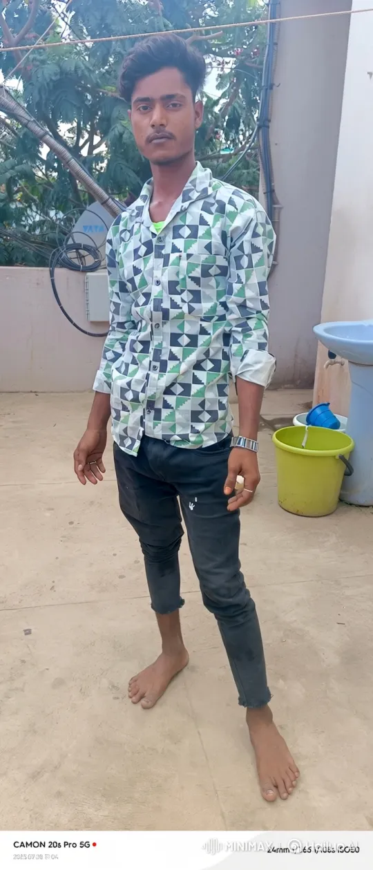Young Man in Geometric Shirt Stares Steadily – AI Generated Video | Hailuo AI