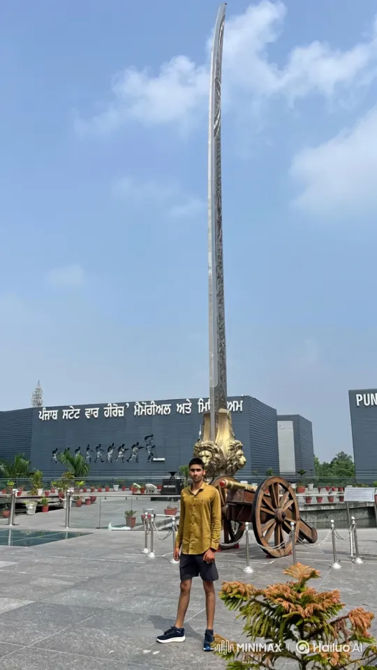Young Man Poses with Monument in Expansive Plaza – AI Generated Video | Hailuo AI