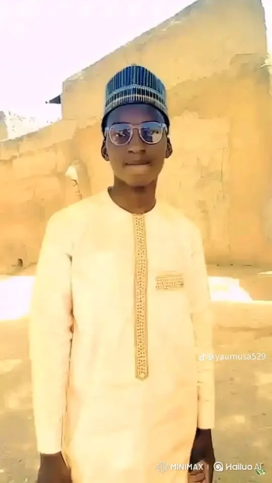 Young Man Smiles Gently in Daylight Setting – AI Generated Video | Hailuo AI