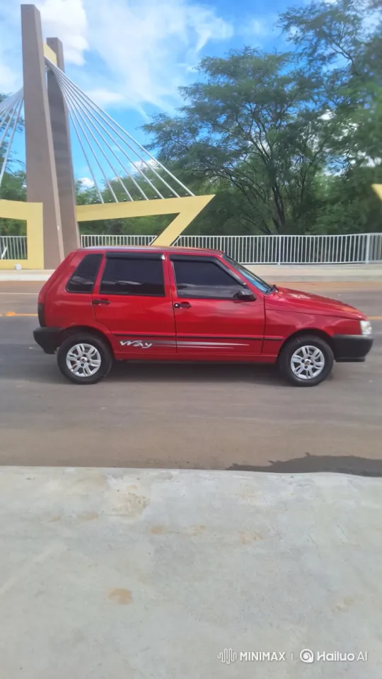 Red Hatchback Car Slowly Lowers on Paved Surface – AI Generated Video | Hailuo AI