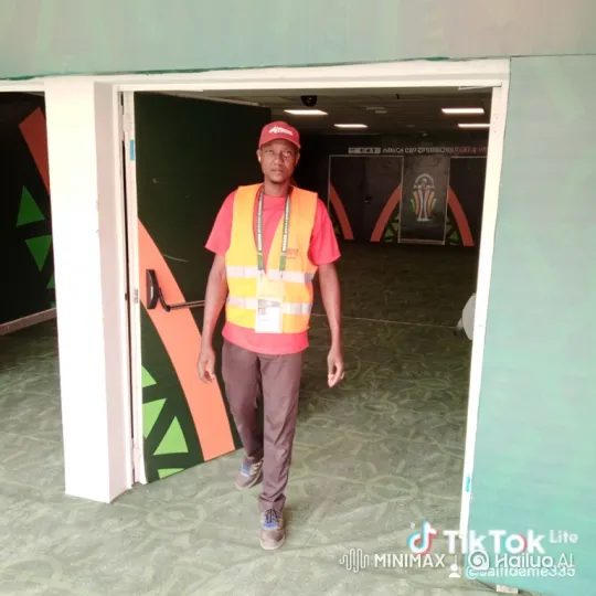 Staff Member Walks Through AFRICA CUP OF NATIONS Corridor – AI Generated Video | Hailuo AI