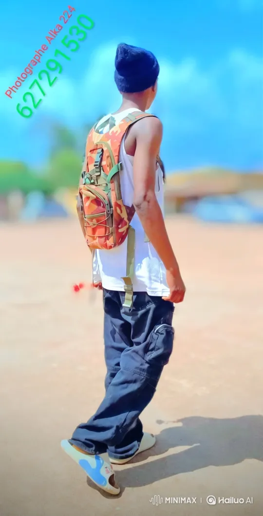 Sunlit Walk: Camouflaged Backpacker on Dusty Path – AI Generated Video | Hailuo AI