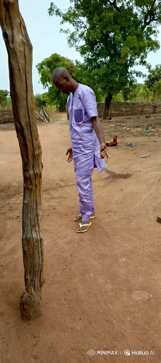 Man in Tunic Contemplates in Rural Yard – AI Generated Video | Hailuo AI