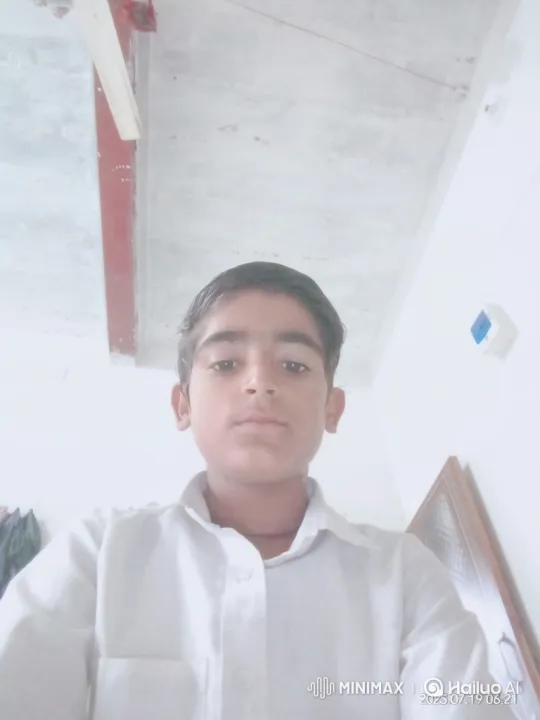 Boy Smiles Gently at Camera in Minimalist Setting – AI Generated Video | Hailuo AI