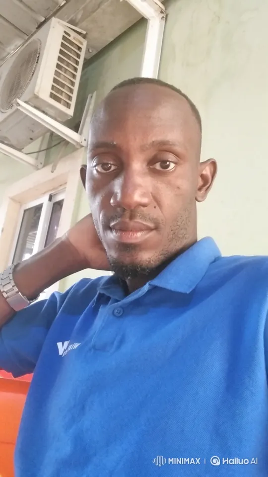 Man in Blue Polo Smiles Gently at Camera – AI Generated Video | Hailuo AI