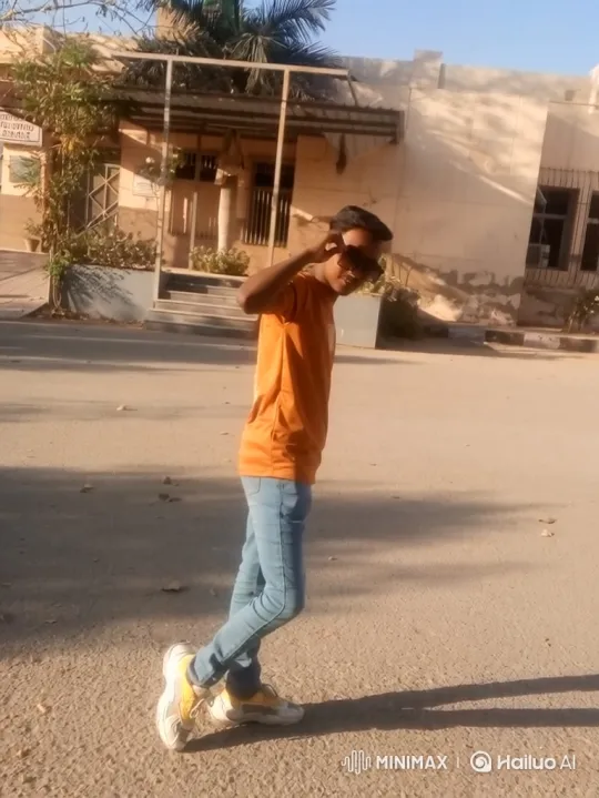 Young Man Poses and Walks Away on Paved Road – AI Generated Video | Hailuo AI