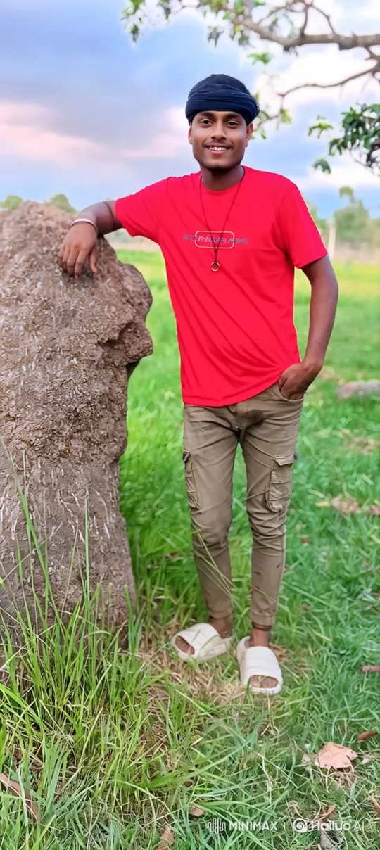 Young Man Smiles in Peaceful Grassland Setting – AI Generated Video | Hailuo AI