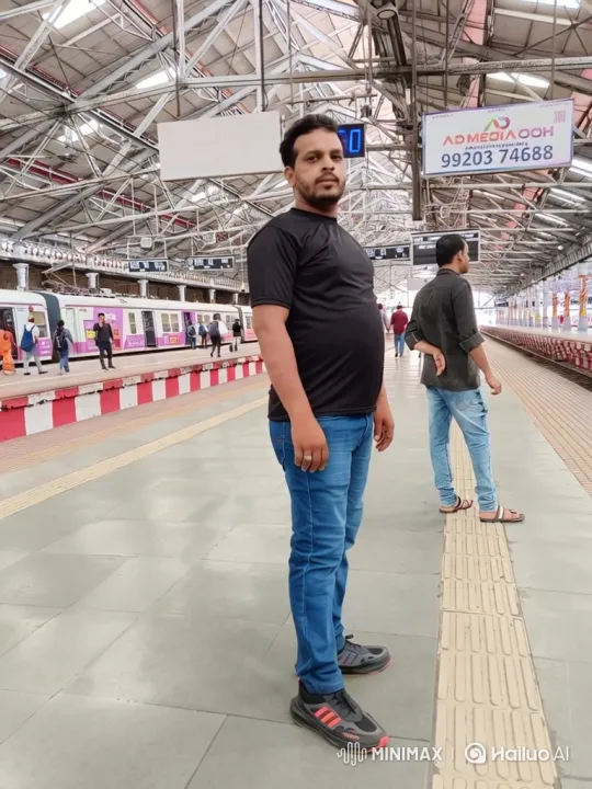 Man on Train Platform: A Tracking Shot Study – AI Generated Video | Hailuo AI