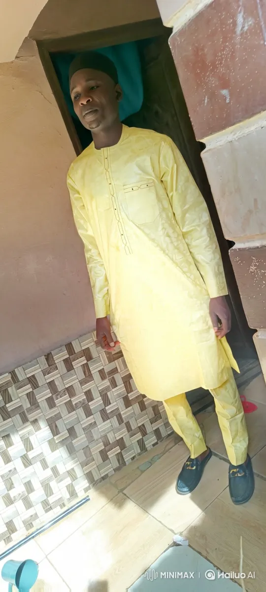 Man in Pale Yellow Clothing Centered in Room Tracking Shot – AI Generated Video | Hailuo AI