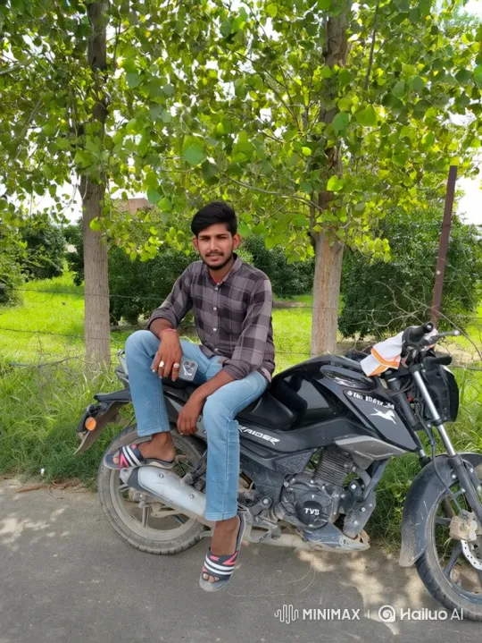 Young Man on Motorcycle in Tranquil Roadside Scene – AI Generated Video | Hailuo AI
