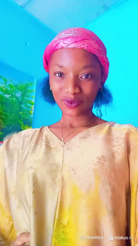 Woman in Pink Headscarf Walks Gracefully Across Frame – AI Generated Video | Hailuo AI