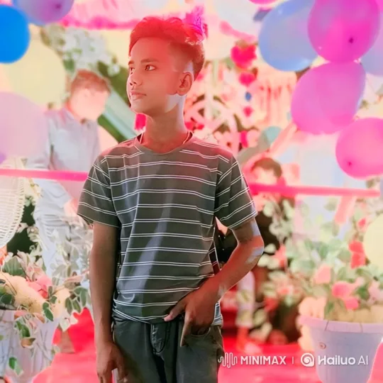 Young Man's Smile in Festive Setting – AI Generated Video | Hailuo AI