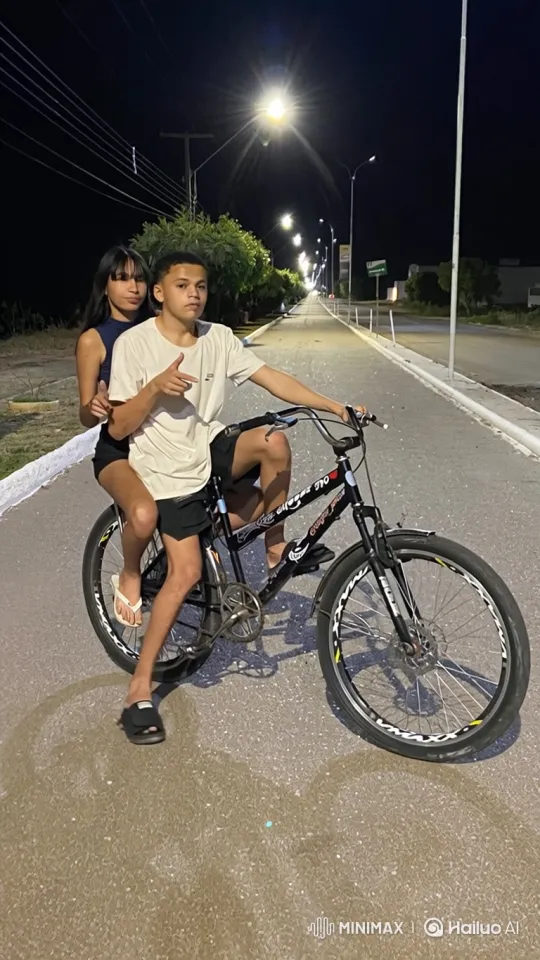 Young Couple Shares Intimate Kiss on Nighttime Bicycle Ride – AI Generated Video | Hailuo AI