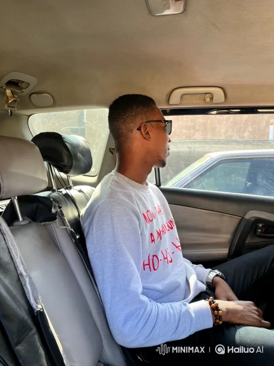 Man in Car: From Looking Out to Confident Smile – AI Generated Video | Hailuo AI