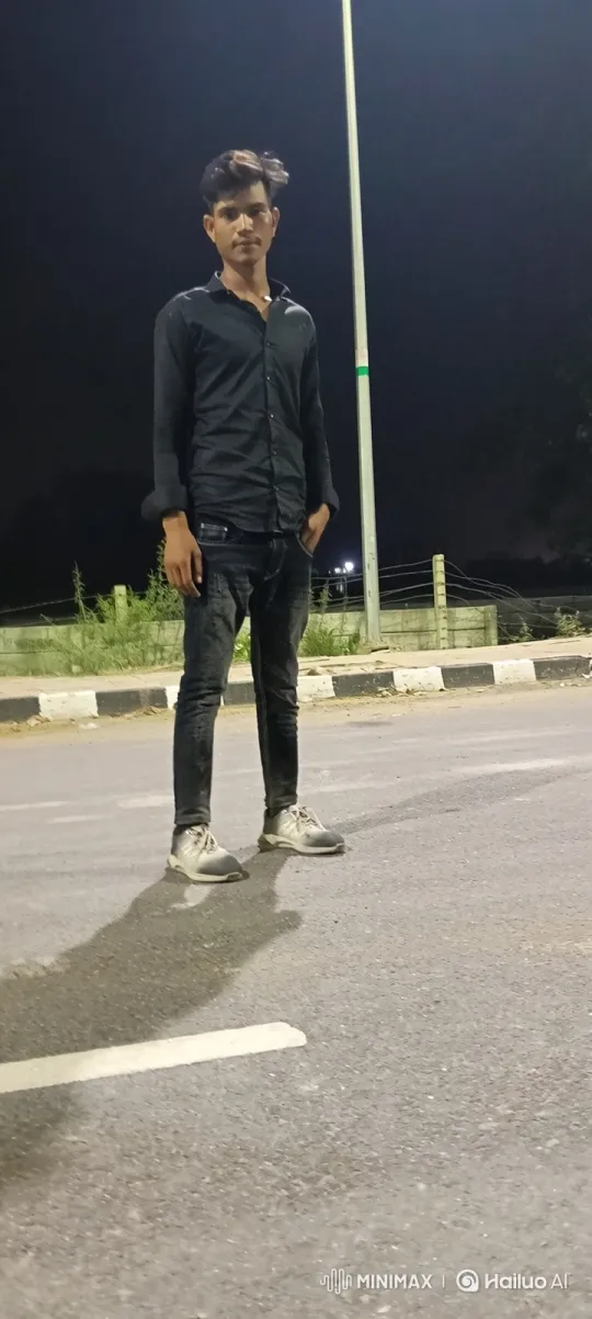 Young Man Stands Still on Empty Road at Night – AI Generated Video | Hailuo AI