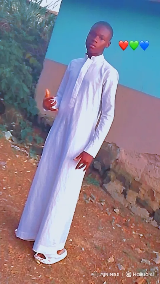 Young Man in White Robe Amidst Golden Hour Dust – AI Generated Video | Hailuo AI