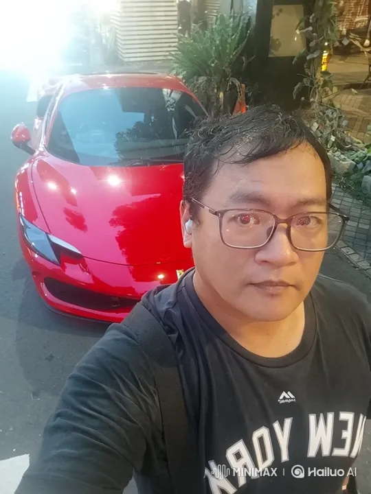 Asian Man Films Red Sports Car with Complex Camera Movement – AI Generated Video | Hailuo AI