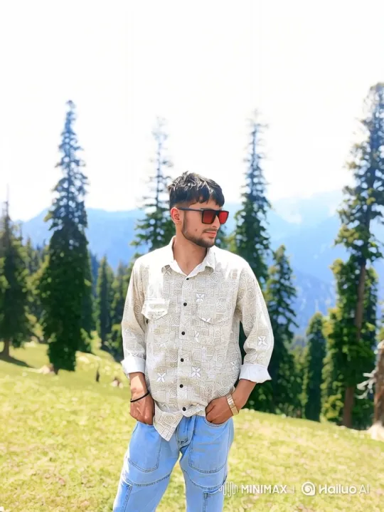 Young Man Smiling on Hillside with Gentle Breeze – AI Generated Video | Hailuo AI