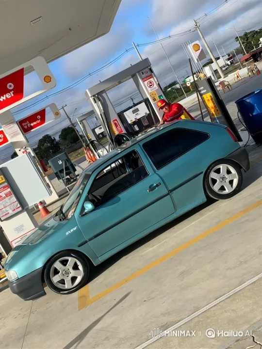 Customized Teal Hatchback with Air Suspension at Shell Station – AI Generated Video | Hailuo AI