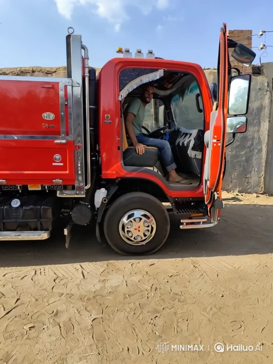 Cheerful Man Showcases His Bright Red Truck in Sunny Setting – AI Generated Video | Hailuo AI