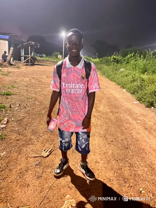 Young Man Smiling on Dirt Path at Night – AI Generated Video | Hailuo AI