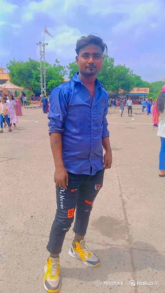 Young Man in Plaza: Calm Gaze Amidst Bustling Scene – AI Generated Video | Hailuo AI