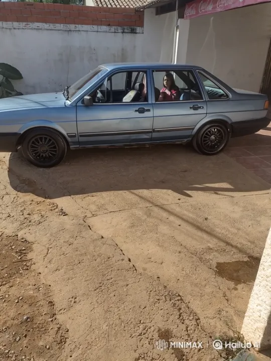 Woman in Pink Shirt Drives Light Blue Sedan – AI Generated Video | Hailuo AI