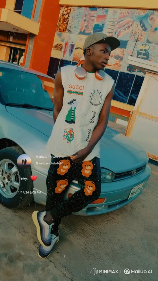 Young Man in Casual Attire Reflects by Car – AI Generated Video | Hailuo AI