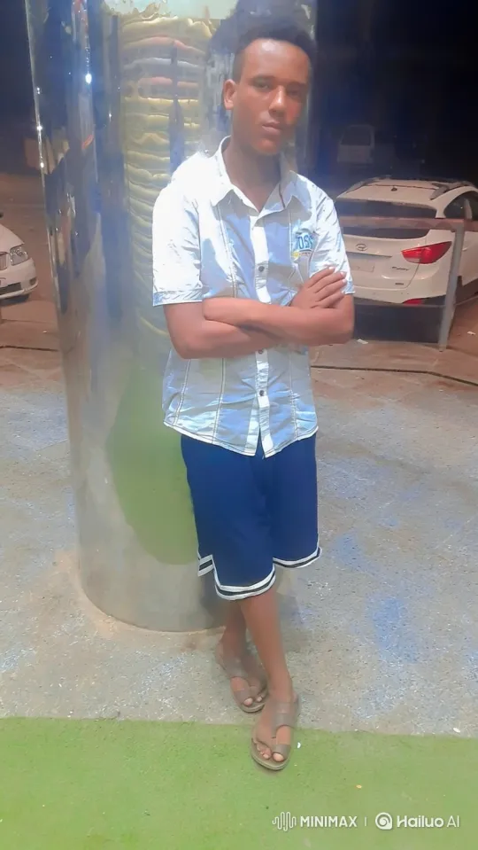 Young Man in Reflective Night Scene with Camera Movement – AI Generated Video | Hailuo AI