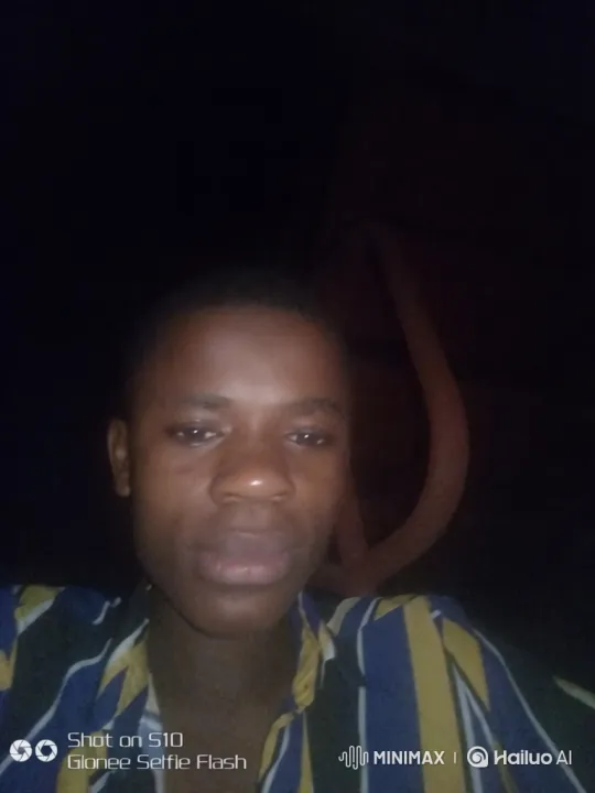 Young Black Man in Striped Shirt Moves Across Dark Screen – AI Generated Video | Hailuo AI