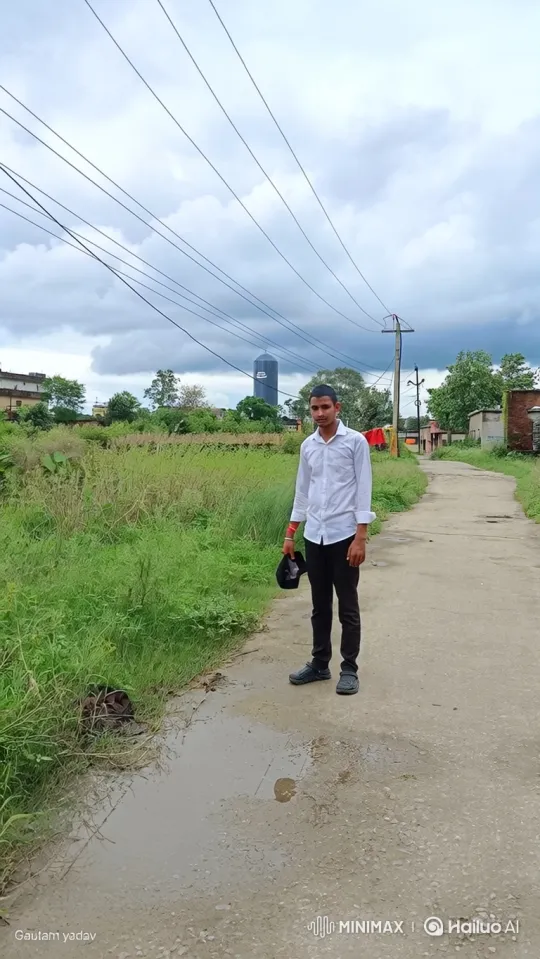 Young Man Stands Still in Rural Setting Amidst Gentle Breeze – AI Generated Video | Hailuo AI