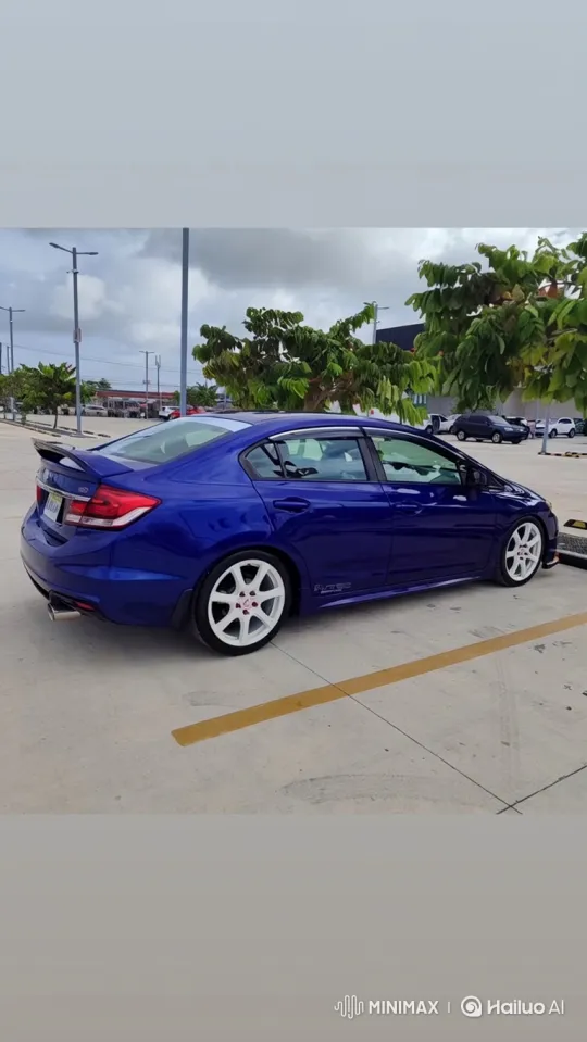 Static Shot of a Vibrant Blue Sedan in a Concrete Lot – AI Generated Video | Hailuo AI