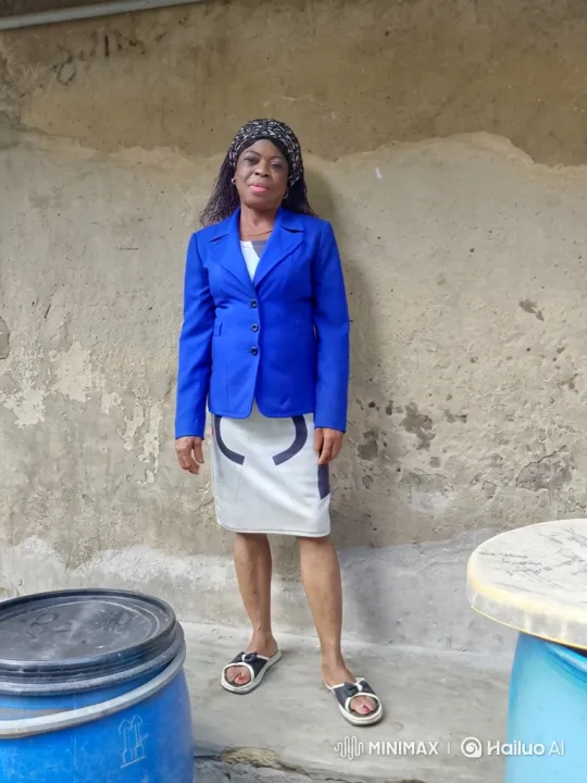 Mature Woman Joyfully Dances in Front of Rustic Wall – AI Generated Video | Hailuo AI