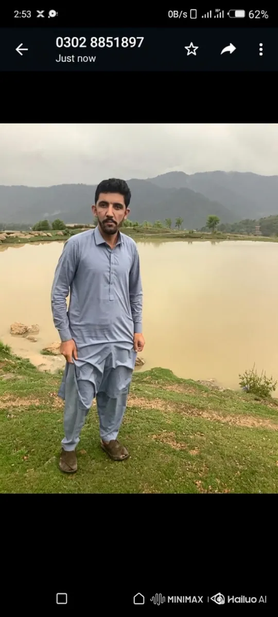 Man in Blue Tunic Observes Peaceful Landscape – AI Generated Video | Hailuo AI