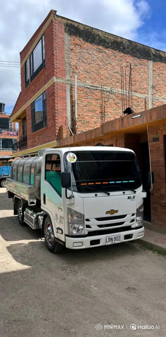 White Chevrolet NLR Tanker Truck Parked on Dirt Road – AI Generated Video | Hailuo AI