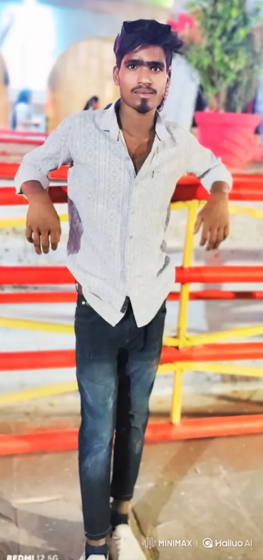 Young Man in Casual Pose, Shifts Attention and Smile – AI Generated Video | Hailuo AI