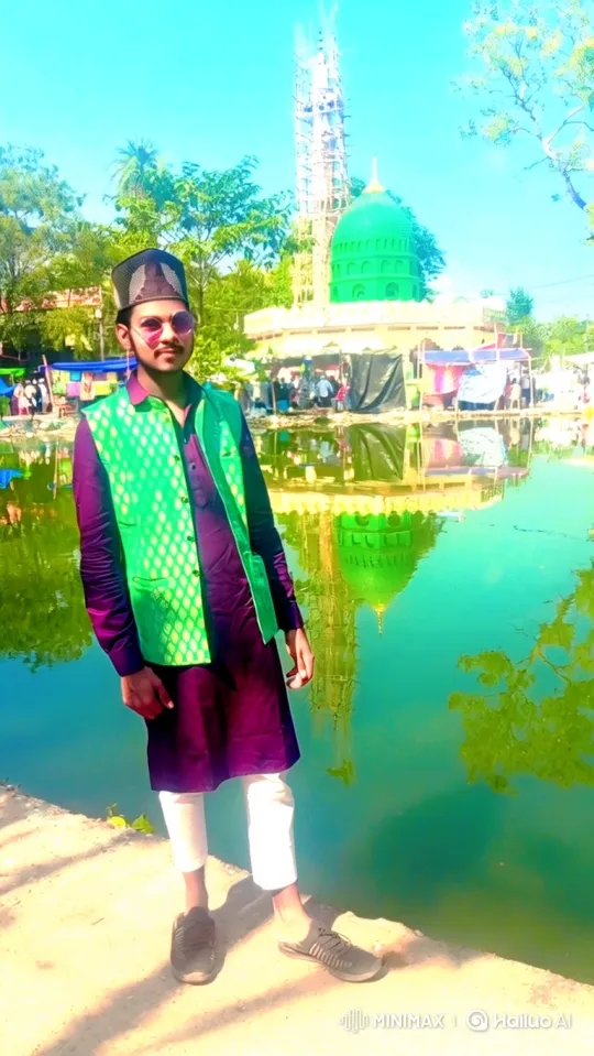 Young Man by Reflective Water with Gentle Breeze – AI Generated Video | Hailuo AI