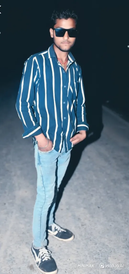 Young Man in Striped Shirt Poses at Night – AI Generated Video | Hailuo AI