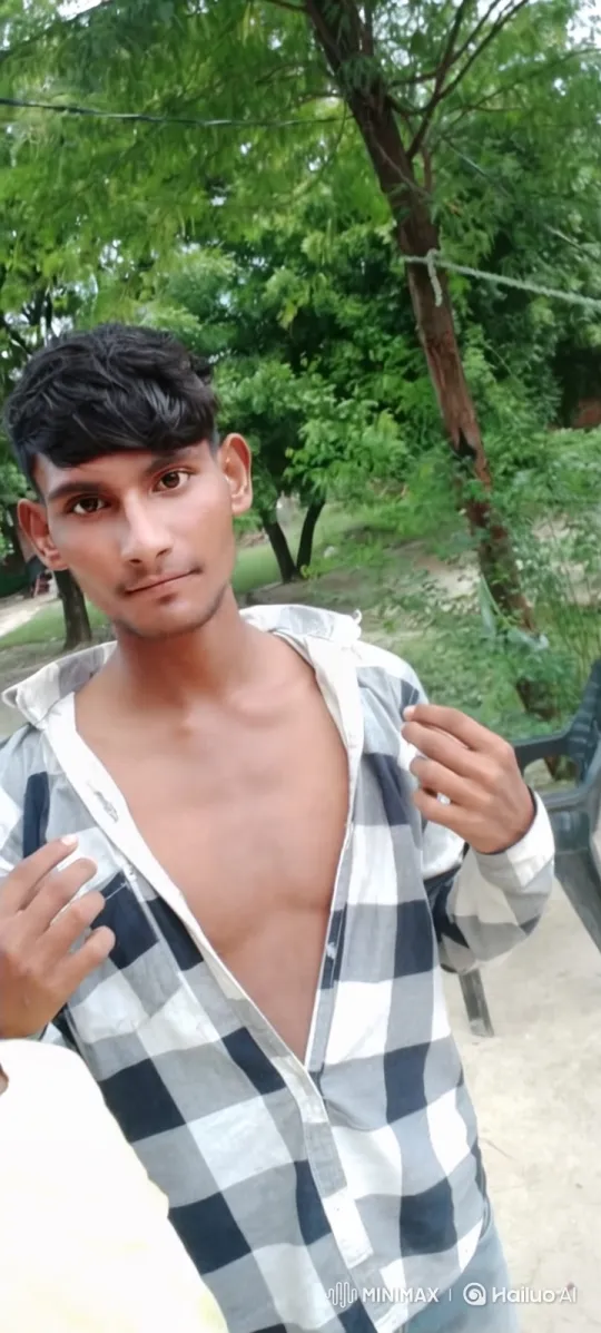 Young Man Walking in Park with Plaid Shirt – AI Generated Video | Hailuo AI